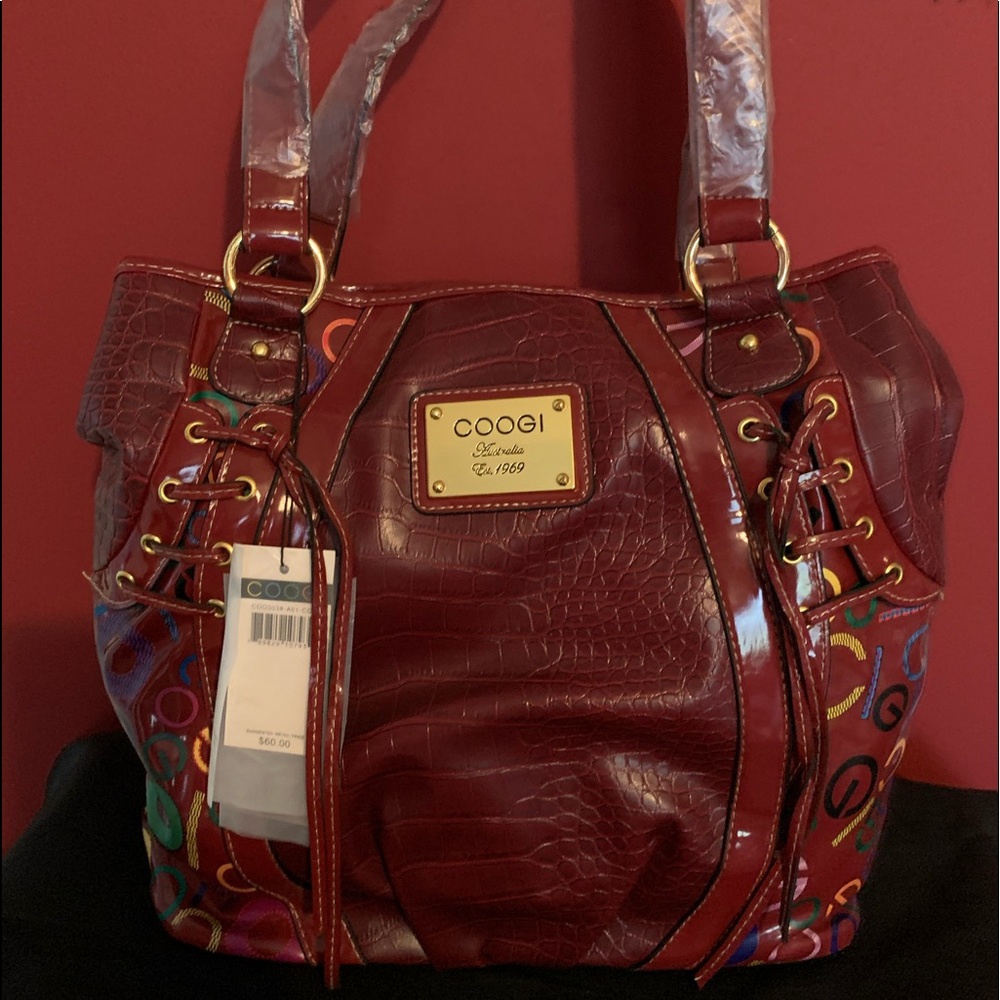 Large designer red tote with multi colors by Coogi
